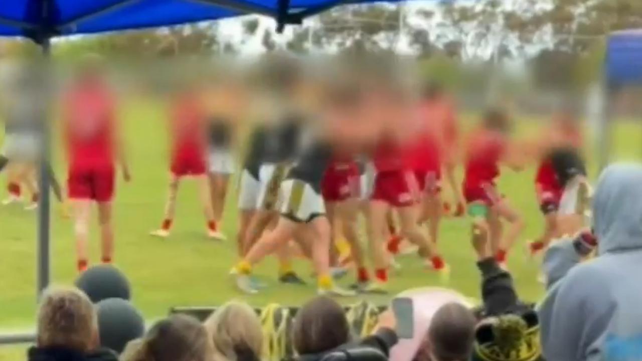 Players engaged in a violent brawl during the under-17 match. Picture: 9News