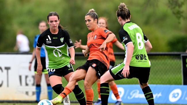 Katrina Gorry passes the ball while playing for Brisbane Roar against Canberra United. Picture: Bradley Kanaris/Getty Images