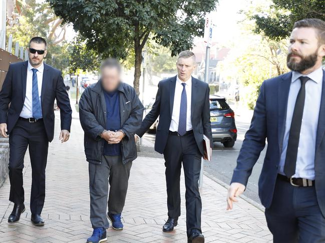 Detective Sergeant John Breda, Detective Chief Inspector Peter Yeomans and Detective Senior Constable Tim Carey arrest Scott Phillip White (blurred) over the alleged murder of Scott Johnson. Picture: NSW Police