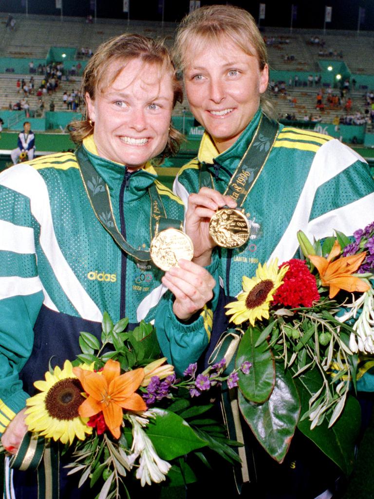 The Powell sisters, Katrina and Lisa, show off their gold medals at the 1996 Atlanta Olympics. Picture: AAP