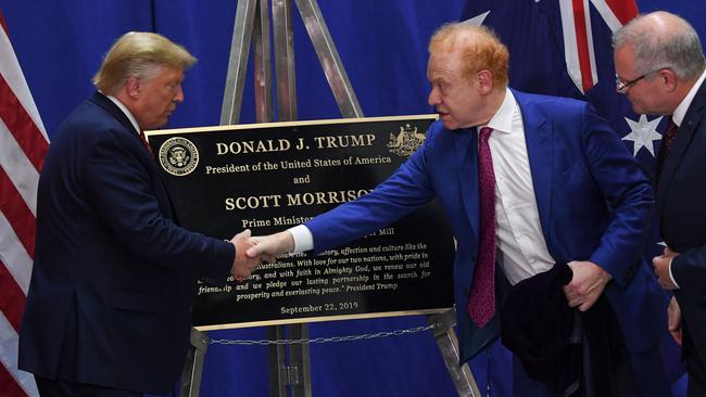 Former US President Donald Trump shaking hands with Anthony Pratt as former Australian Prime Minister Scott Morrison looks on during a visit to a Pratt Industries plant in Wapakoneta, Ohio, in September 2019. Picture: Saul Loeb / AFP