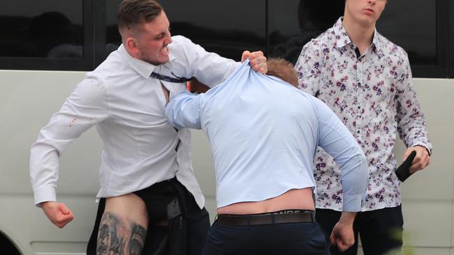 Brandon Thomas Locke-Walker’s (left) clothes were ripped when the brawl broke out at Rosehill Racecourse in December. Picture: Mark Evans/Getty Images