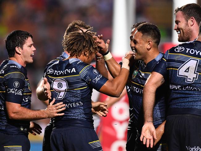 TOWNSVILLE, AUSTRALIA - AUGUST 20: Ray Thompson of the Cowboys celebrates after scoring a try with team mates during the round 24 NRL match between the North Queensland Cowboys and the New Zealand Warriors at 1300SMILES Stadium on August 20, 2016 in Townsville, Australia. (Photo by Ian Hitchcock/Getty Images)