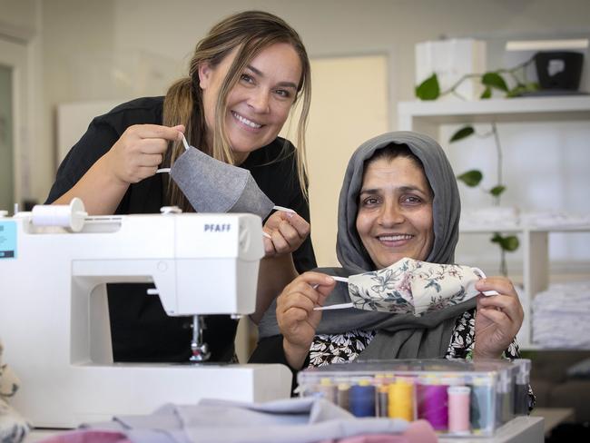 Founding director of Be Hers Melody Towns and seamstress Storai Ghulam Sakhi at Hobart. Picture: Chris Kidd