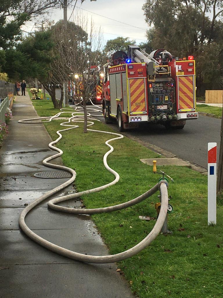 Firefighters at the scene on Sunday morning. Picture: Ken Irwin