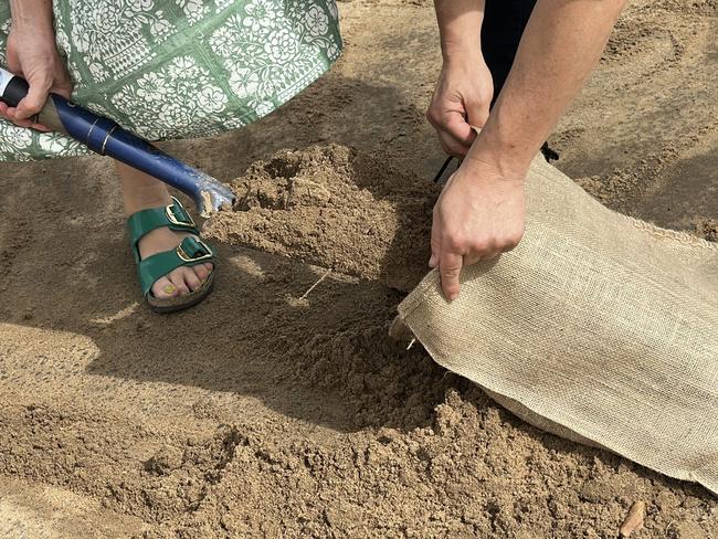 Lismore residents bagging sand in South Lismore as northern NSW prepares for Cyclone Alfred. Picture: Cath Piltz