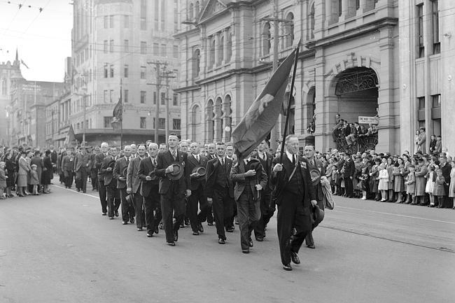 Thel 1947 Anzac Day Parade marches along Macquarie Street past the Hobart Town Hall,