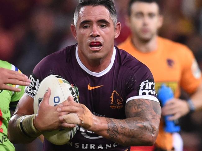 Corey Parker of the Brisbane Broncos (centre) gains ground during their Round 14 NRL game against the Canberra Raiders at Suncorp Stadium in Brisbane, Thursday, June 9, 2016.(AAP Image/Dan Peled) NO ARCHIVING, EDITORIAL USE ONLY