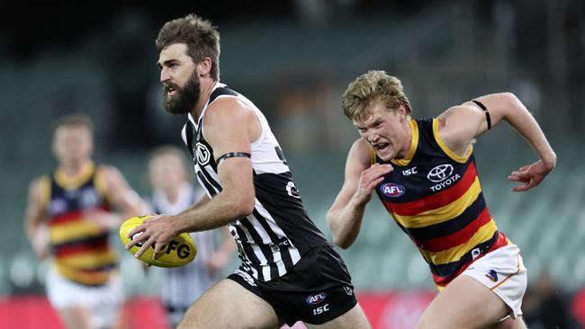 Port Adelaide’s Justin Westhoff breaks clear of Adelaide’s Fischer McAsey in the Round 2 Showdown. Picture: Sarah Reed