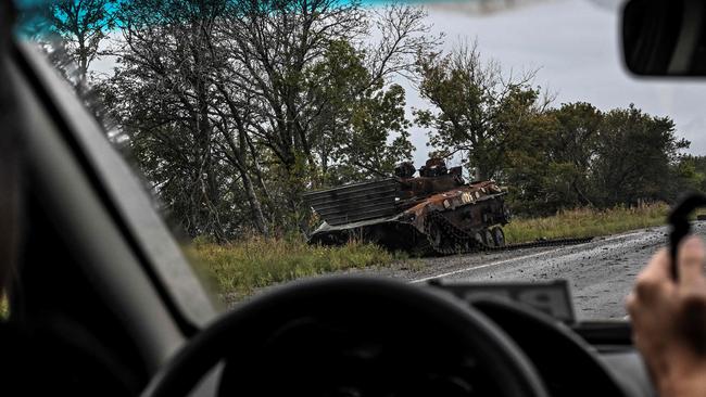 A destroyed Russian BMP infantry fighting vehicle lies on the side of the road on the outskirts of Izyum, Kharkiv Region, eastern Ukraine. Picture: Juan Barreto/AFP