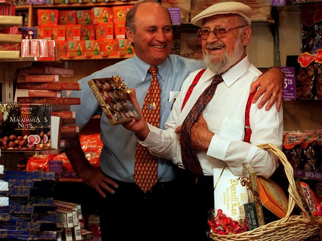 Founder of Darrell Lea confectionery shop Monty Lea (r) with son Jason in their Sydney store.