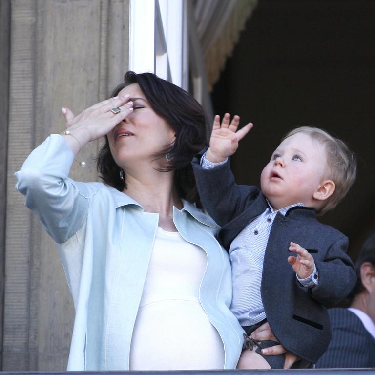 Prince Christian practices his royal waves and catches his mother in the eye on the balcony at Amalienborg Palace. Picture: John McConnico/AP