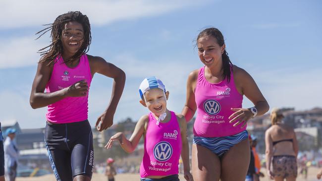 Archer Irwin was made part of the South Maroubra Nippers club on Saturday. With his heroes Malikye Kessie and Angelina Garay.Picture: Matthew Vasilescu