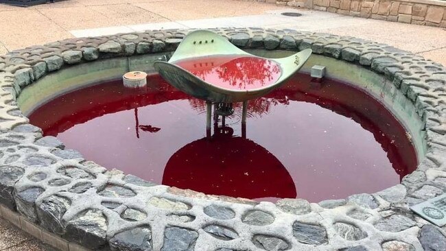 Protesters dyed a University of Queensland fountain red. Picture: Facebook