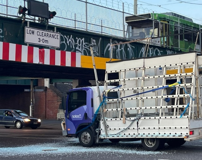 A truck carrying glass has smashed into the Montague St bridge. Picture: 3AW