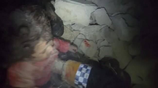 Crying baby freed from Syria earthquake wreckage