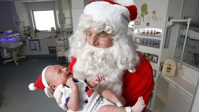 Santa with baby Soren Stillwell. Picture: David Caird