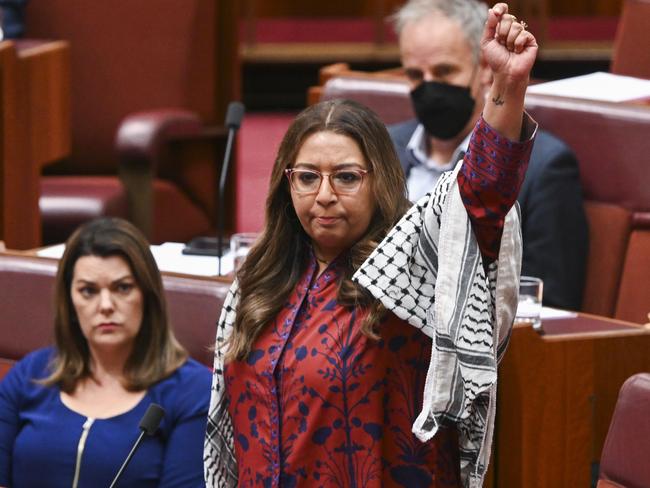 Greens Senator Mehreen Faruqi leads a walkout. Picture: Martin Ollman/NCA NewsWire