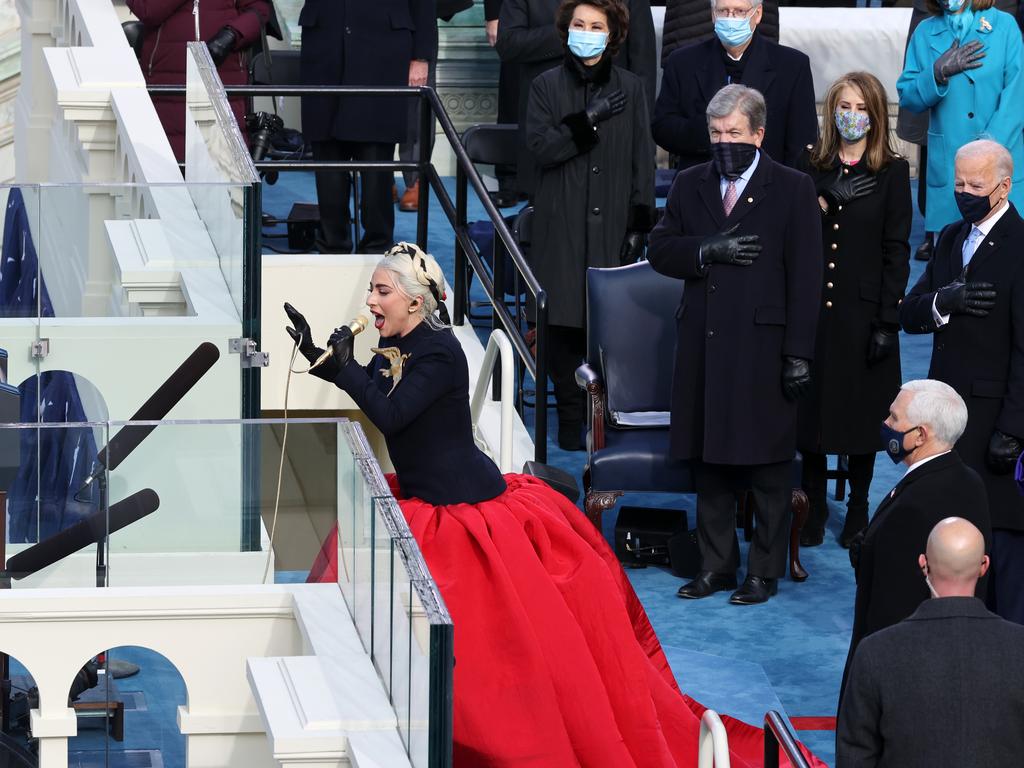 Lady Gaga wore a billowing Schiaparelli ball gown and an unmissable dove pin. Picture: Getty Images