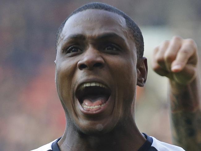 Watford's Odion Ighalo, left, celebrates scoring his side's first goal with Troy Deeney during the English FA Cup quarterfinal soccer match between Arsenal and Watford at the Emirates stadium in London, Sunday, March 13, 2016. (AP Photo/Matt Dunham)