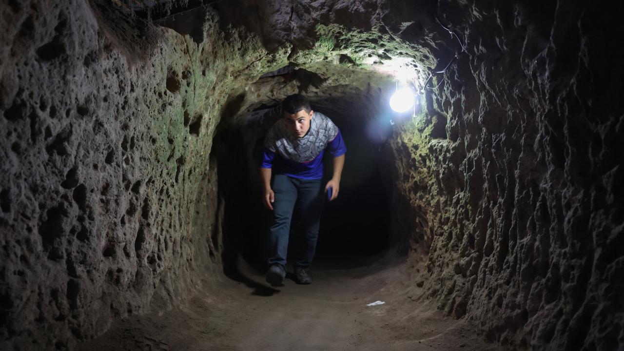 A tourist walks through a passage in the Derinkuyu underground city, in Turkey's central Nevsehir province. (Photo by OMAR HAJ KADOUR / AFP)