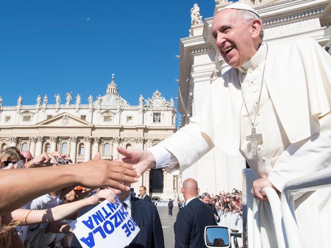 Popular Pontiff: Pope Francis greets the faithful during his weekly general audience at the Vatican on Wednesday, August 24. Picture: L'Osservatore Romano/Pool Photo via AP