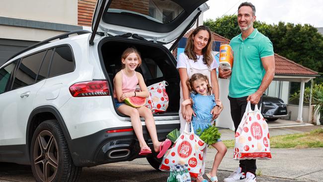 Alex and Vicki Ryvchin with their children Lilah, 8, Elly, 5, at home in Dover Heights. Picture: Justin Lloyd.