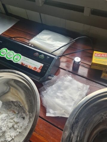 Police say they located and seized 1.6kg of cocaine, $27,000 cash, a drug press and drug related paraphernalia. Picture: QPS Media
