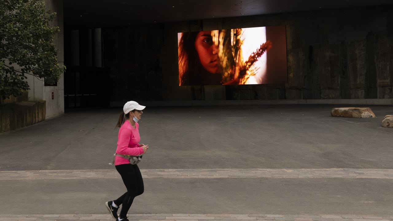 A jogger is seen in Barangaroo on Tuesday in Sydney's CBD. Photo: Brook Mitchell/Getty Images
