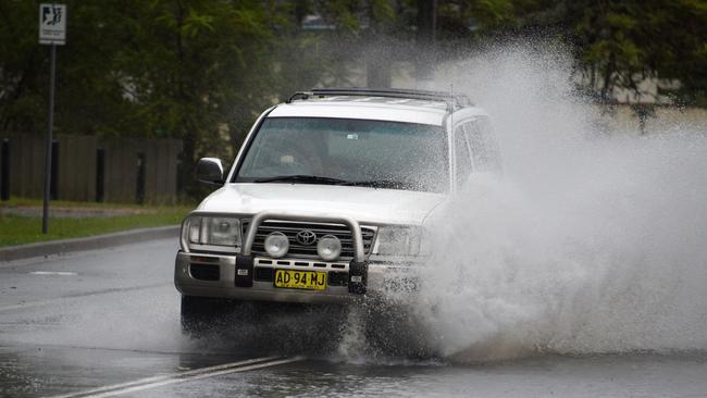 Flooding spills onto a road from the Tweed River at Chinderah on Monday. Picture: NCA NewsWire/Steve Holland.