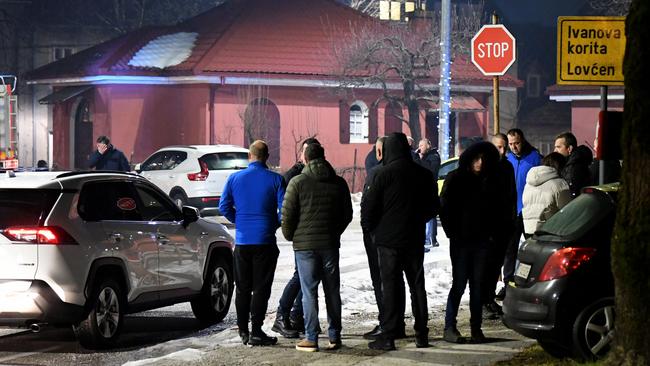 Police officers and civil protection units secure the crime scene. Picture: Savo Prelevic/AFP