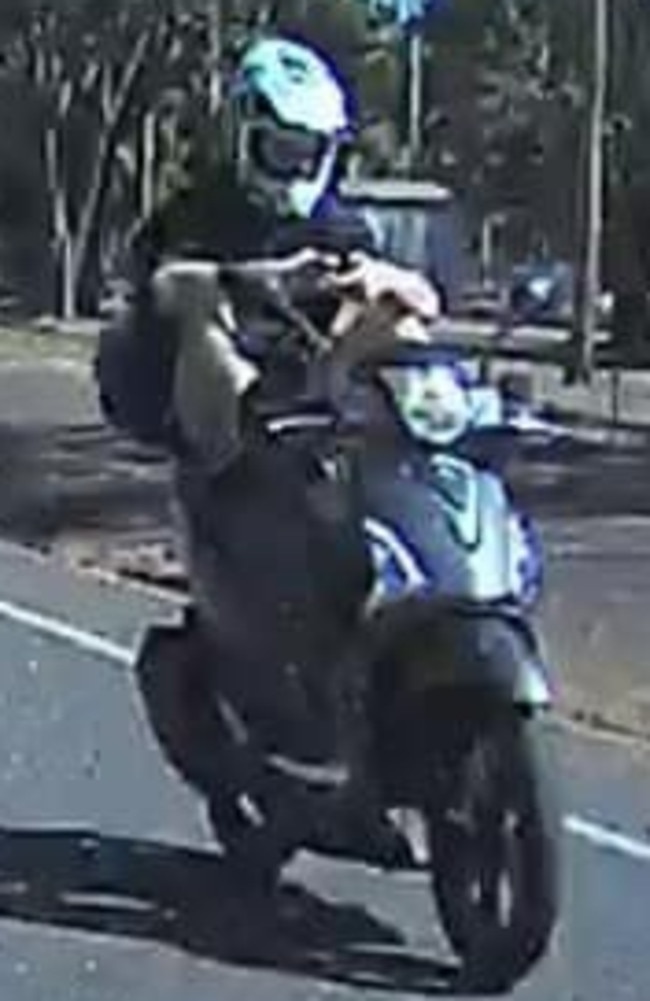 A motorcyclist at McMinns Lagoon has been captured riding with his feet to free up his hands in order to fire off a text message. Picture: Facebook