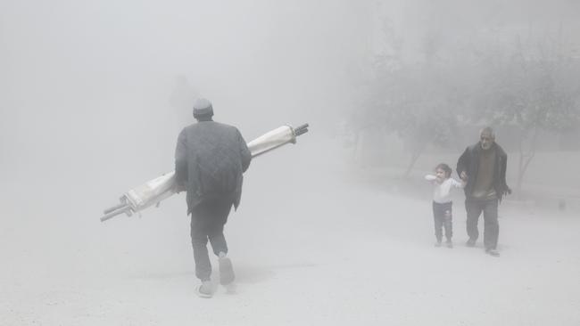 The use of chemical weapons has previously been deemed a ‘red line’ by the US government, but it hasn’t helped oust President Assad. Pictured, a man and girl flee a rebel-controlled town in eastern Ghouta. Picture: AFP/Abdulmonam Eassa