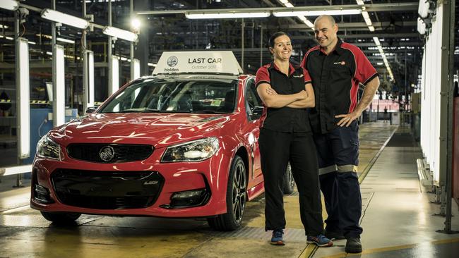 The final 2017 VF Commodore sedan coming down the final line at the Holden Elizabeth factory. Pictured are employees Lisa Hutchinson and Andrew Wyett. Credit: Randy Larcombe