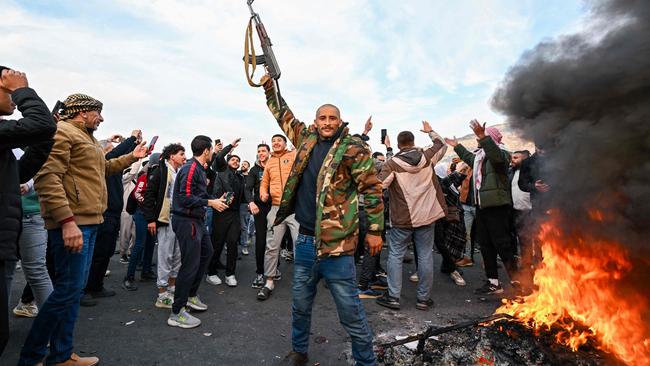 People celebrate at Umayyad Square in Damascus. Picture: Louai Beshara/AFP