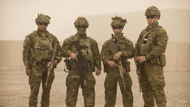 An Australian Army Force Protection team prepares to step off during a dust storm at the Taji Military Complex in Iraq. Picture: LSIS Jake Badior.