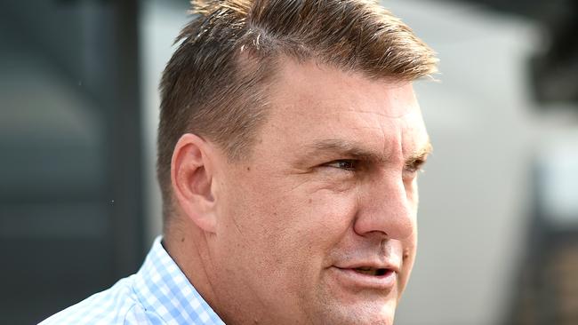 Trainer Chris Anderson speaks to the media after James Orman rode Equipped to victory in race 4, the Benchmark 75 Handicap, during Metro Races at Doomben Racecourse in Brisbane, Saturday, December 7, 2019. (AAP Image/Albert Perez)