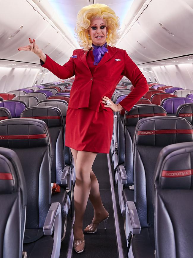 Live in-flight entertainment will be hosted by members of the RuPaul’s Drag Race Down Under cast, including Penny Tration (pictured). Picture: Virgin Australia