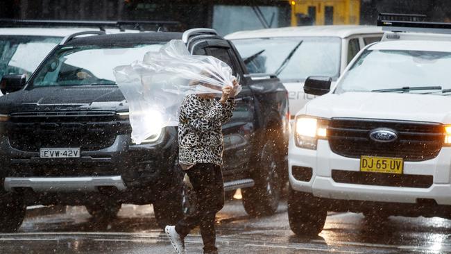 Heavy rain falls in the CBD on Monday. Picture: NewsWire / Nikki Short