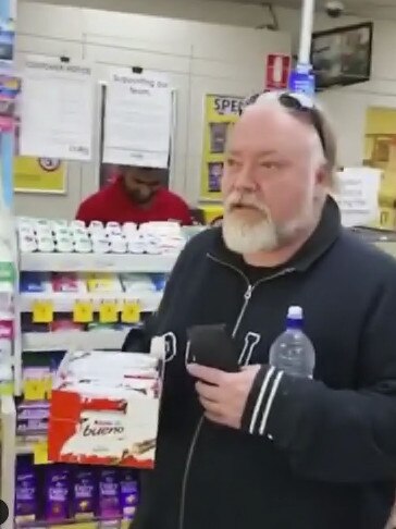 Kyle Sandilands at the convenience store picking up chocolate.