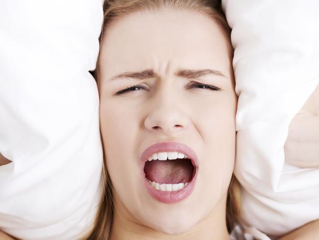 Blocking out a partner's snoring. iStock pic free to use.