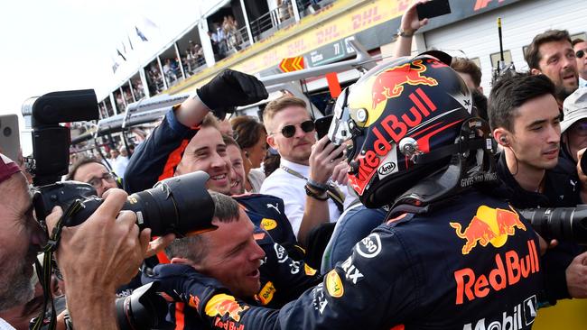 Second placed Red Bull Racing's Dutch driver Max Verstappen celebrates with teammates after the Formula One Grand Prix de France at the Circuit Paul Ricard in Le Castellet, southern France, on June 24, 2018. / AFP PHOTO / GERARD JULIEN