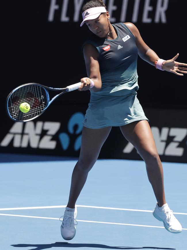 Japan's Naomi Osaka makes a forehand return.