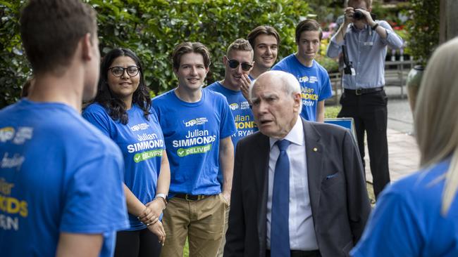 Former Australian Prime Minister John Howard meets young liberals on the campaign trail with the Member for Ryan, Julian Simmonds, at Brookfield Gardens Nursery. NewsWire / Sarah Marshall