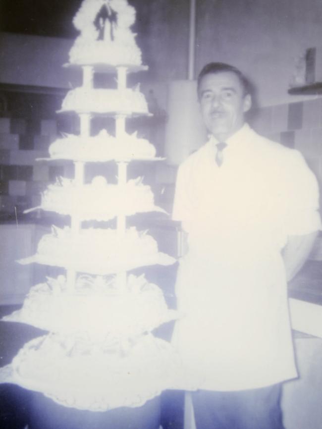 A photo of original owner Angelo Mezzapica with a seven-tier wedding cake in circa 1952.