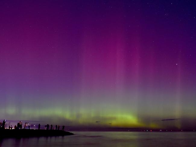 People watch the light show at Port Phillip Bay. Picture: Paul Crock