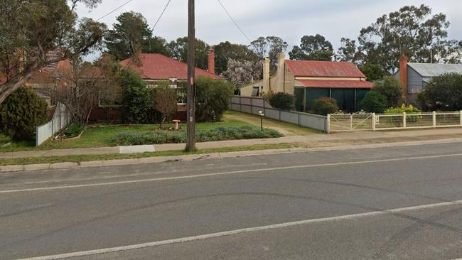 A woman is with police after she allegedly drove into a Numurkah house this afternoon.