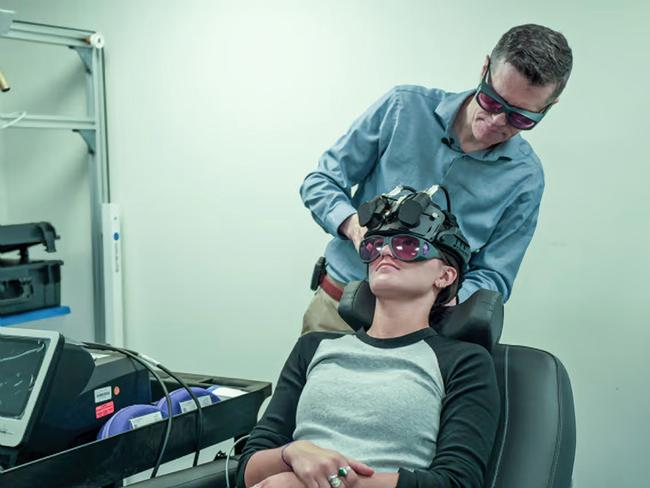 Dr Paolo Cassano works with a photobiomodulation device. Picture: Massachusetts General Hospital