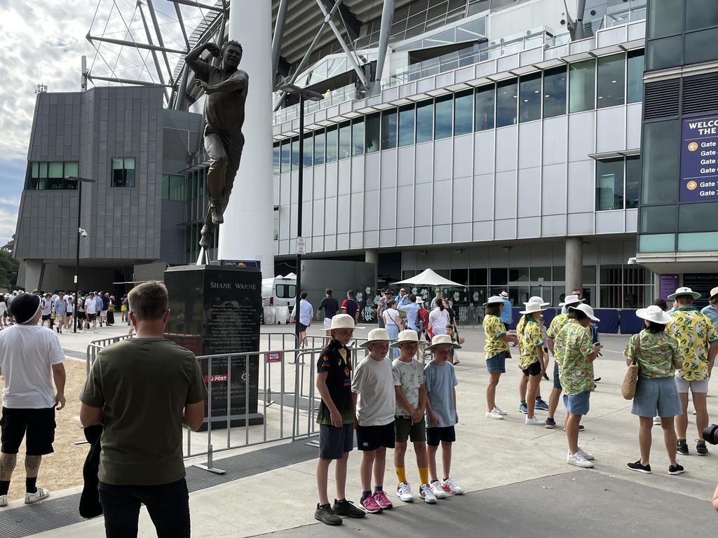 Four young fans have their moment in front of the statue. Picture: Ben Waterworth