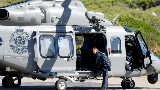 Police search for the missing swimmer at Gunnamatta Ocean Beach. Picture: Andrew Henshaw